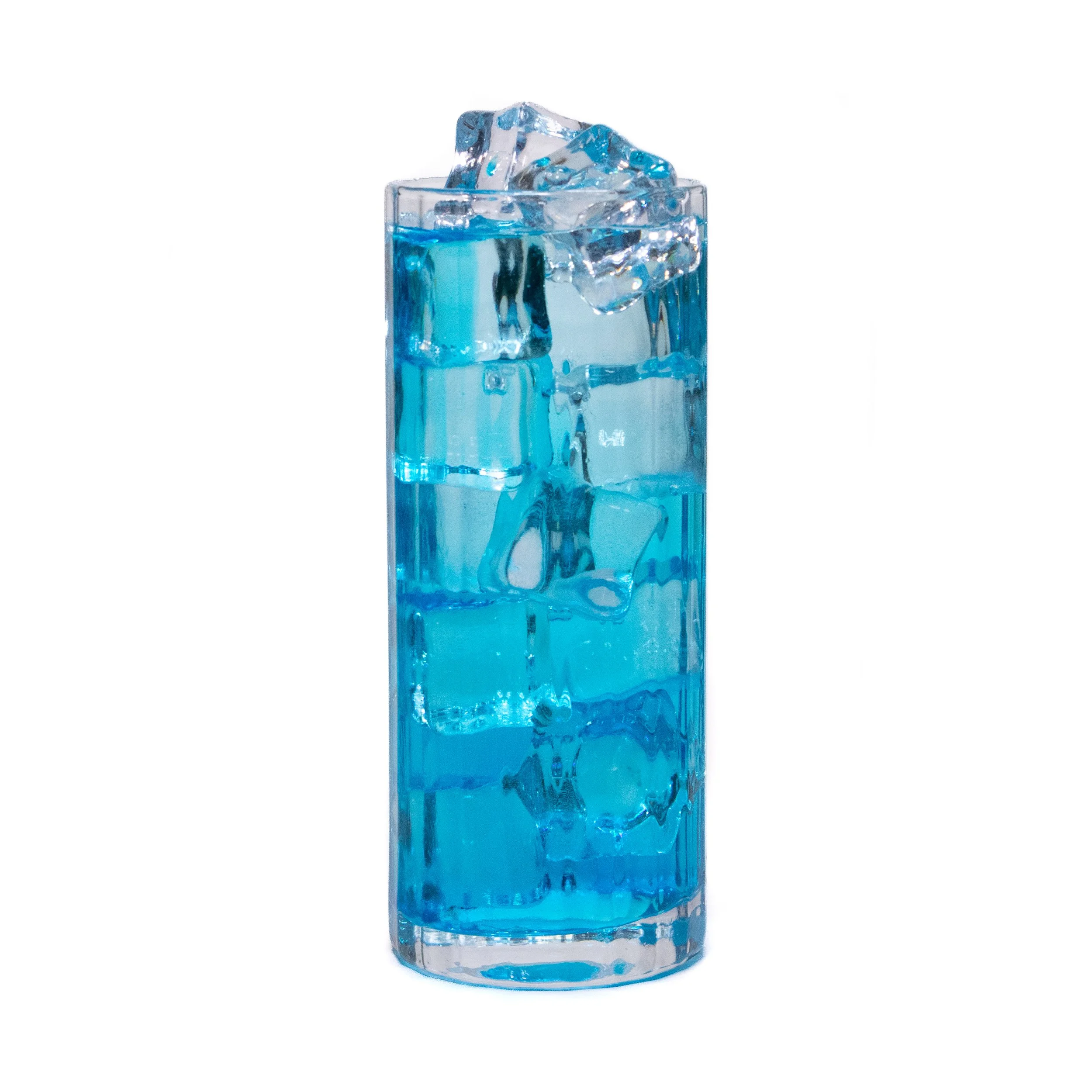 A tall glass filled with blue liquid and ice cubes.