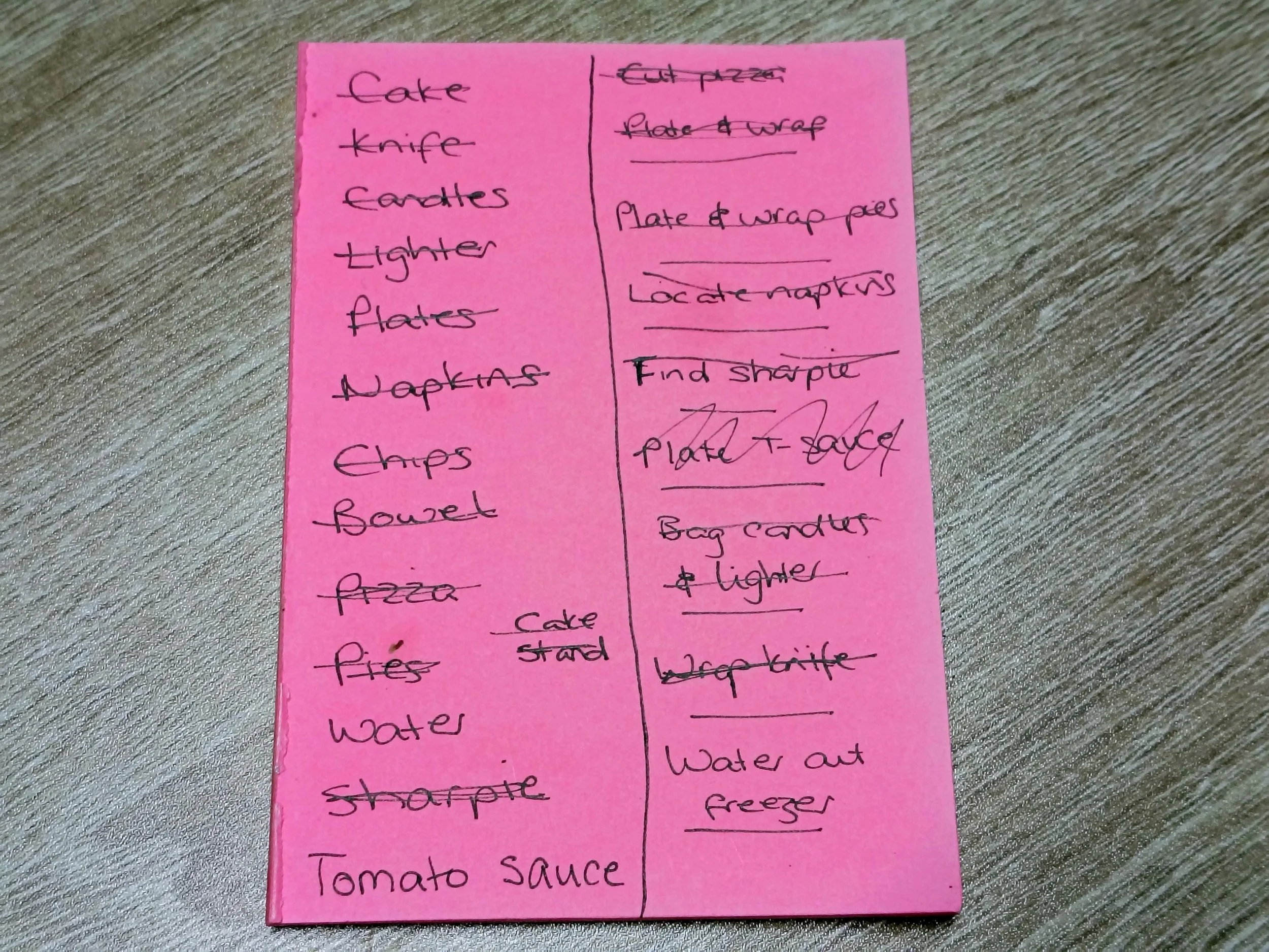 Bright pink handwritten to-do list broken into very small party-prep steps, illustrating hidden load and early warning signs of reduced capacity in ADHD.