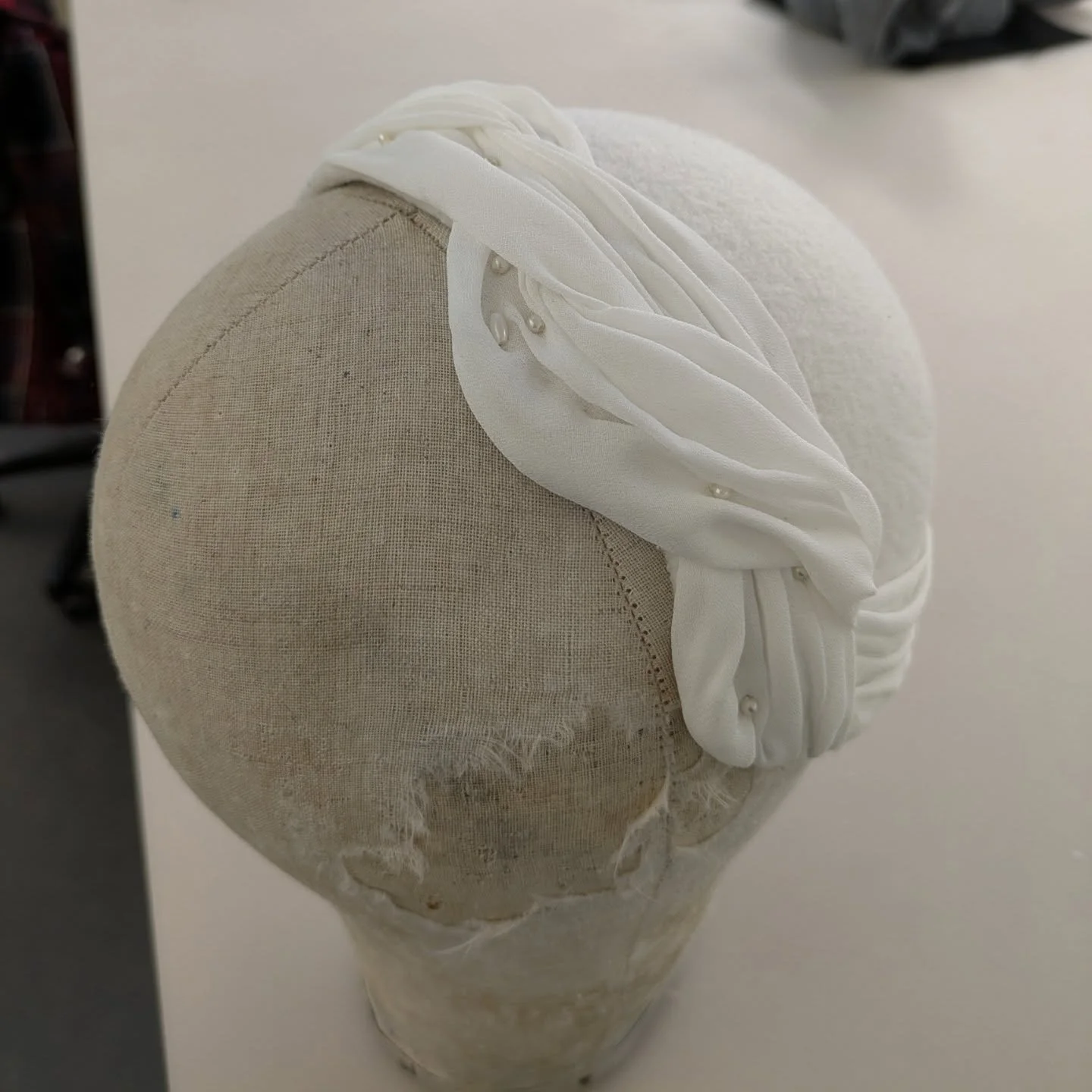 1950's blocked half hat, swipe to see the process 🤍
This hat began as a flat piece of buckram that was stretched over the head block, once dried the hairline was cut out and the hat design drawn on. Don't forget the fitting! Milliners wire is shaped
