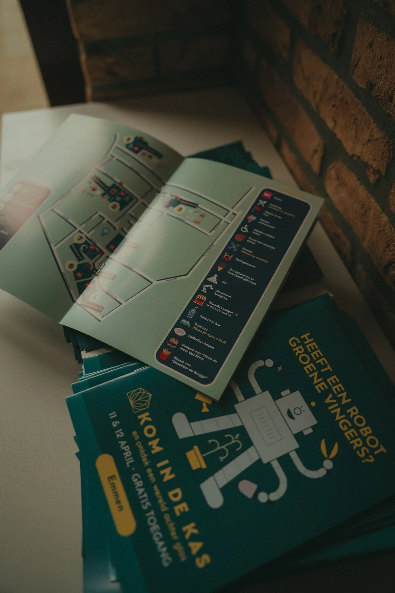 Brochure or flyer with a map and icons of various tourist attractions, including a tram, monument, shopping cart, coffee, and more, likely providing information about a city or region.