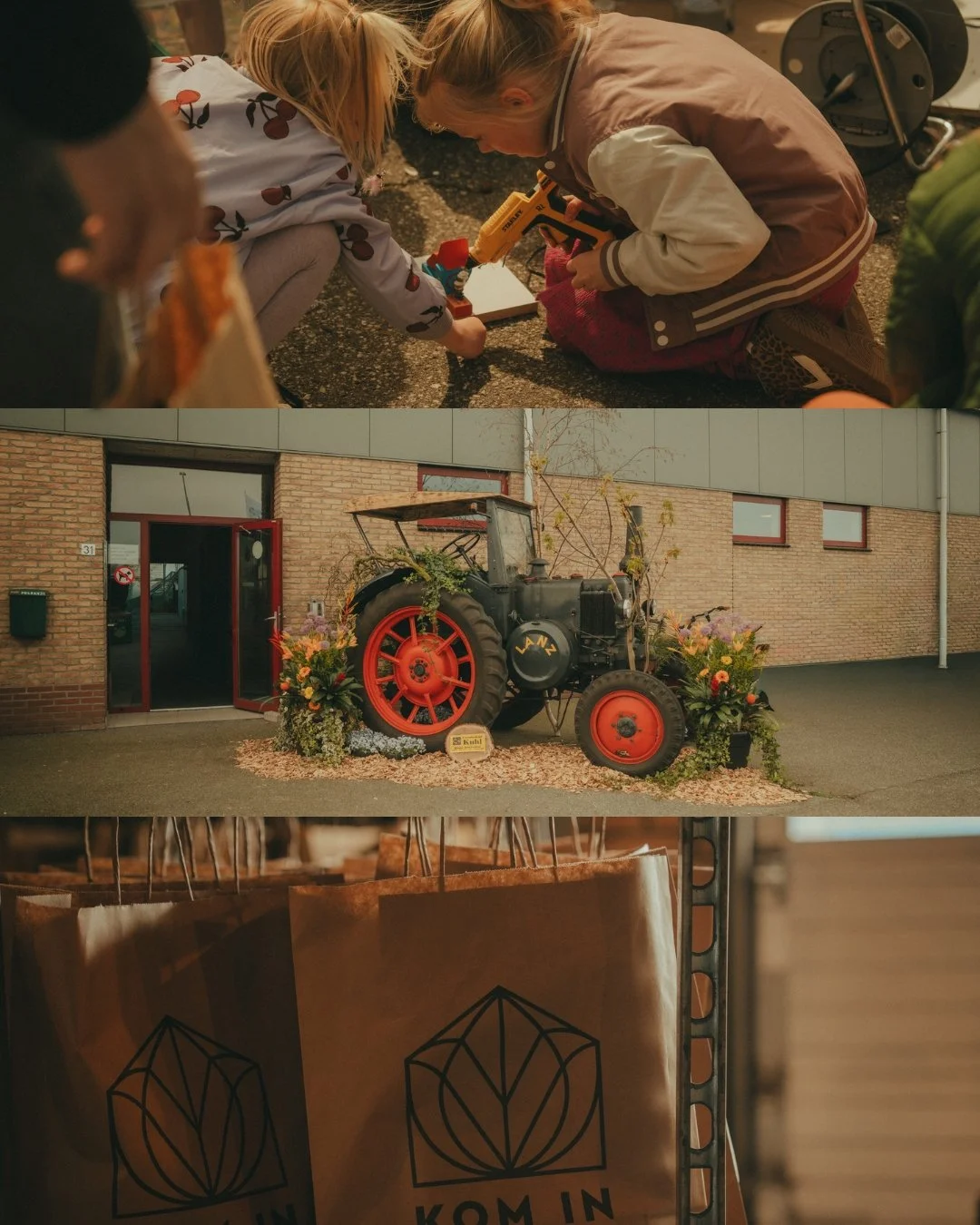 Children playing with a toy gun on the ground, an old tractor decorated with flowers outside a building, and brown paper bags with a black geometric logo hanging on display.