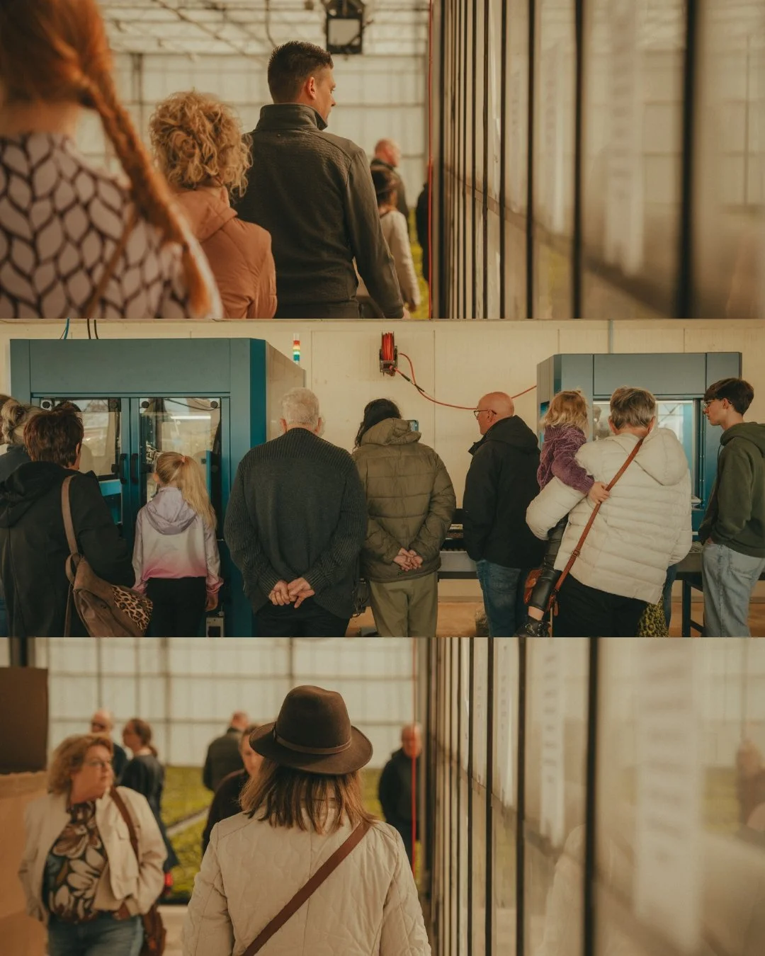 People in a line at an airport security checkpoint, with separated screening machines, inside a large hangar or warehouse