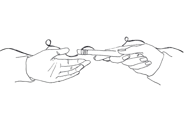 Two hands exchanging a USB flash drive.