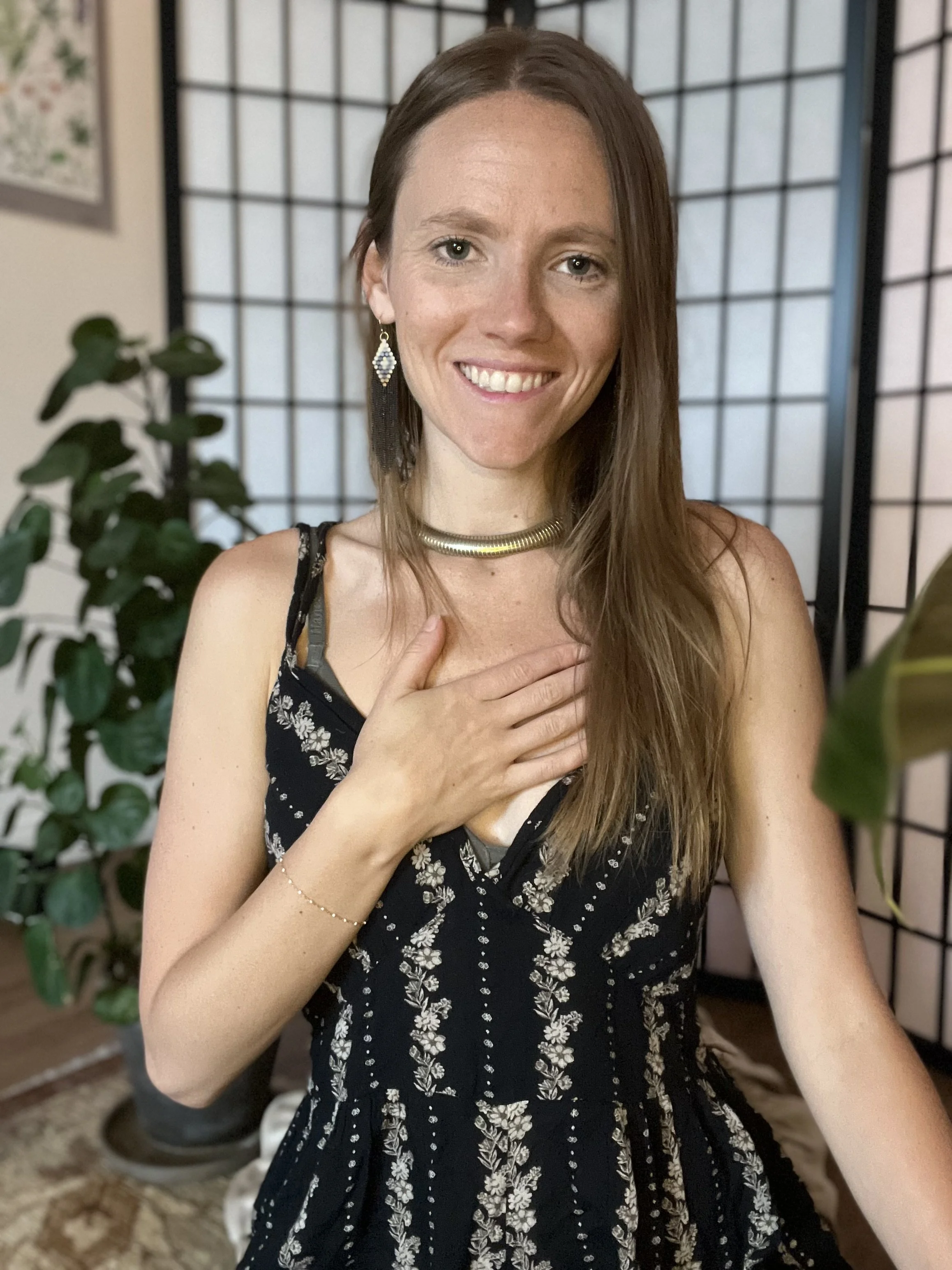 Julia Dyer smiling, one hand resting on her heart
