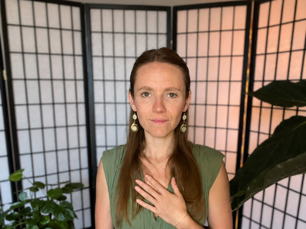 Julia Dyer, founder and teacher of Steady Self School, with one hand resting at her heart