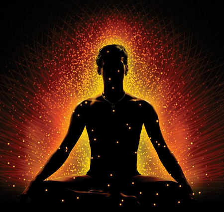 Silhouette of a person sitting in a meditative pose with glowing dots and radiant light effects surrounding them
