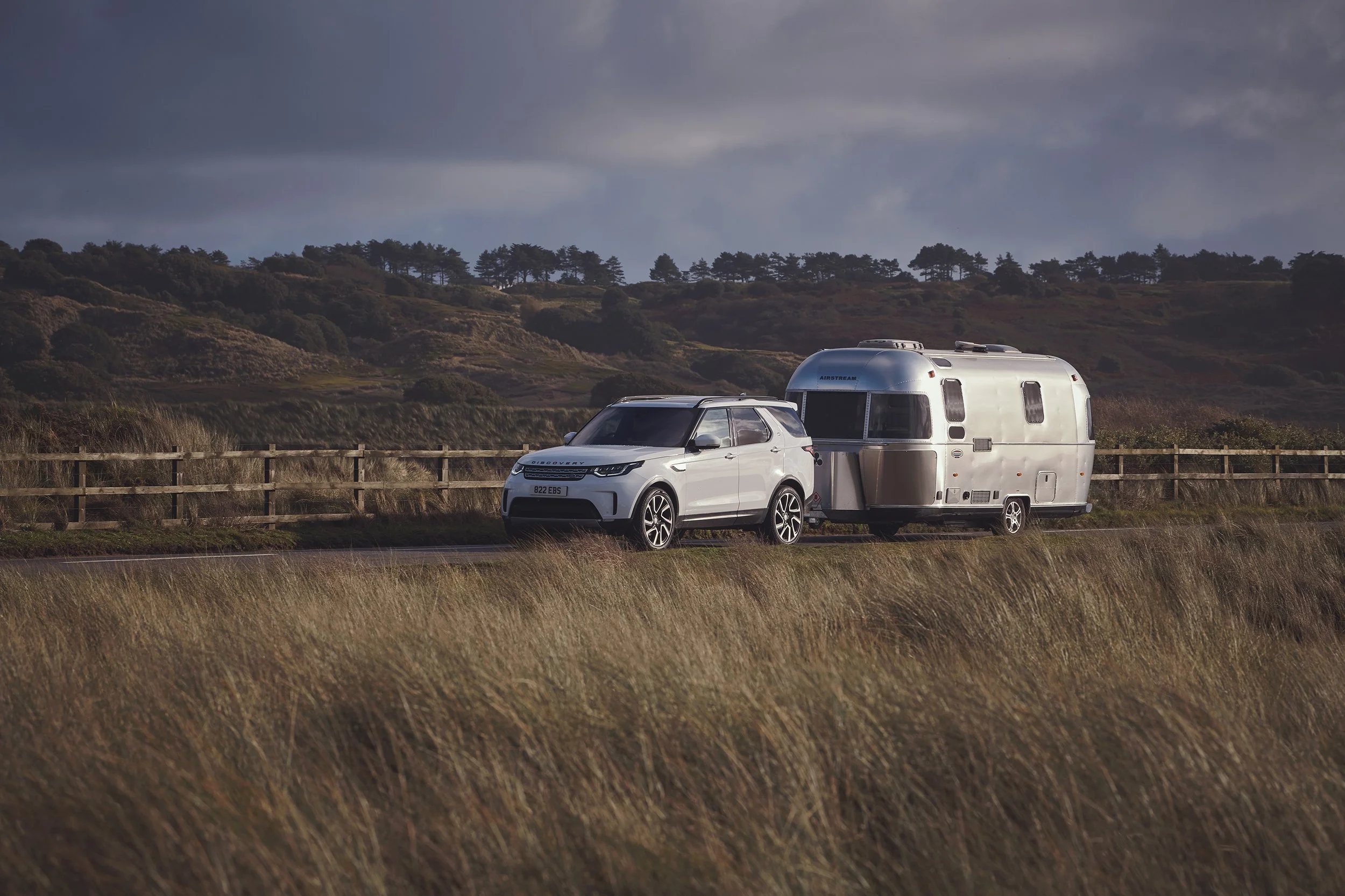 A Land Rover Discovery towing an Airstream caravan