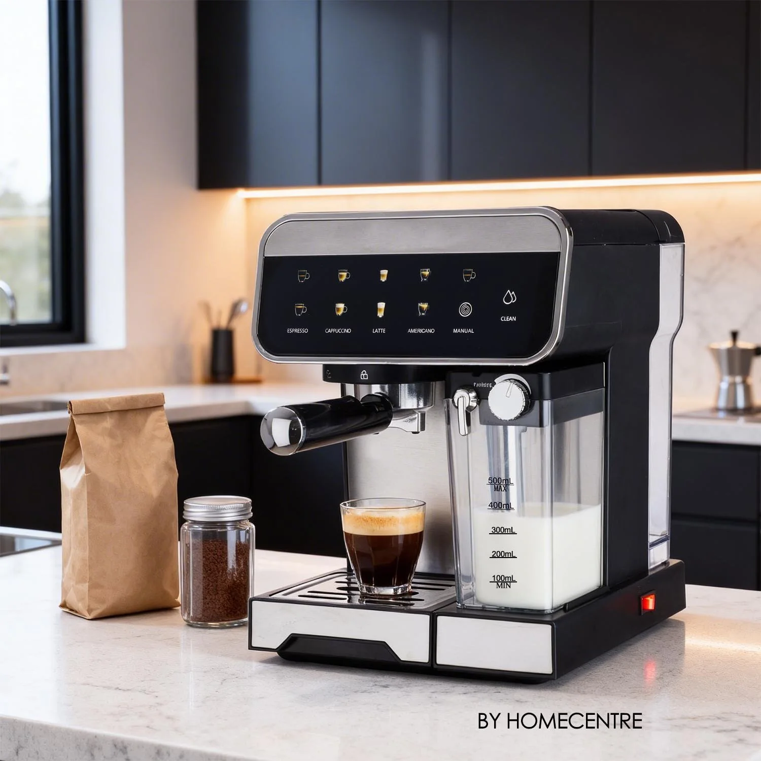 A modern coffee maker brewing coffee, with a glass of coffee underneath, on a kitchen countertop next to a bag of coffee beans and a jar of ground coffee.