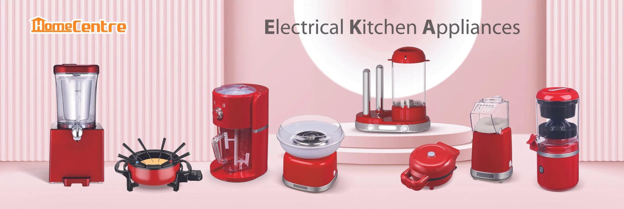 Display of red electrical kitchen appliances including a blender, coffee maker, food processor, juicer, and other small appliances on a pink background with a pink striped pattern.