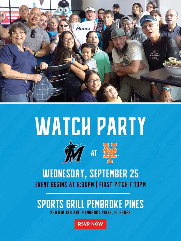 Group of smiling people gathered together at an event, with a sign indicating a Watch Party for Miami Marlins at New York Mets on September 25, held at Sports Grill Pembroke Pines.