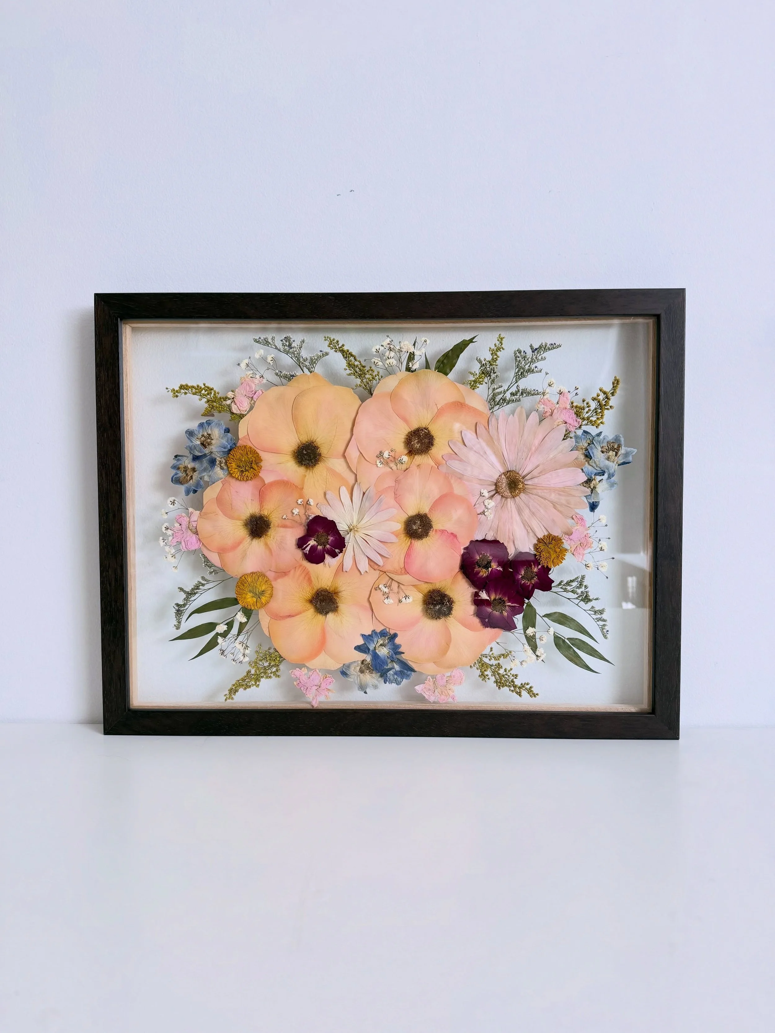 this sweet and colourful bouquet made it all the way home to British Columbia✈️🌸✨ 

12x16&rdquo; floating glass frame, dark wood📸
 

#bouquetpreservation #pressedflowerart #flowerpreservation #weddingkeepsake #2026wedding