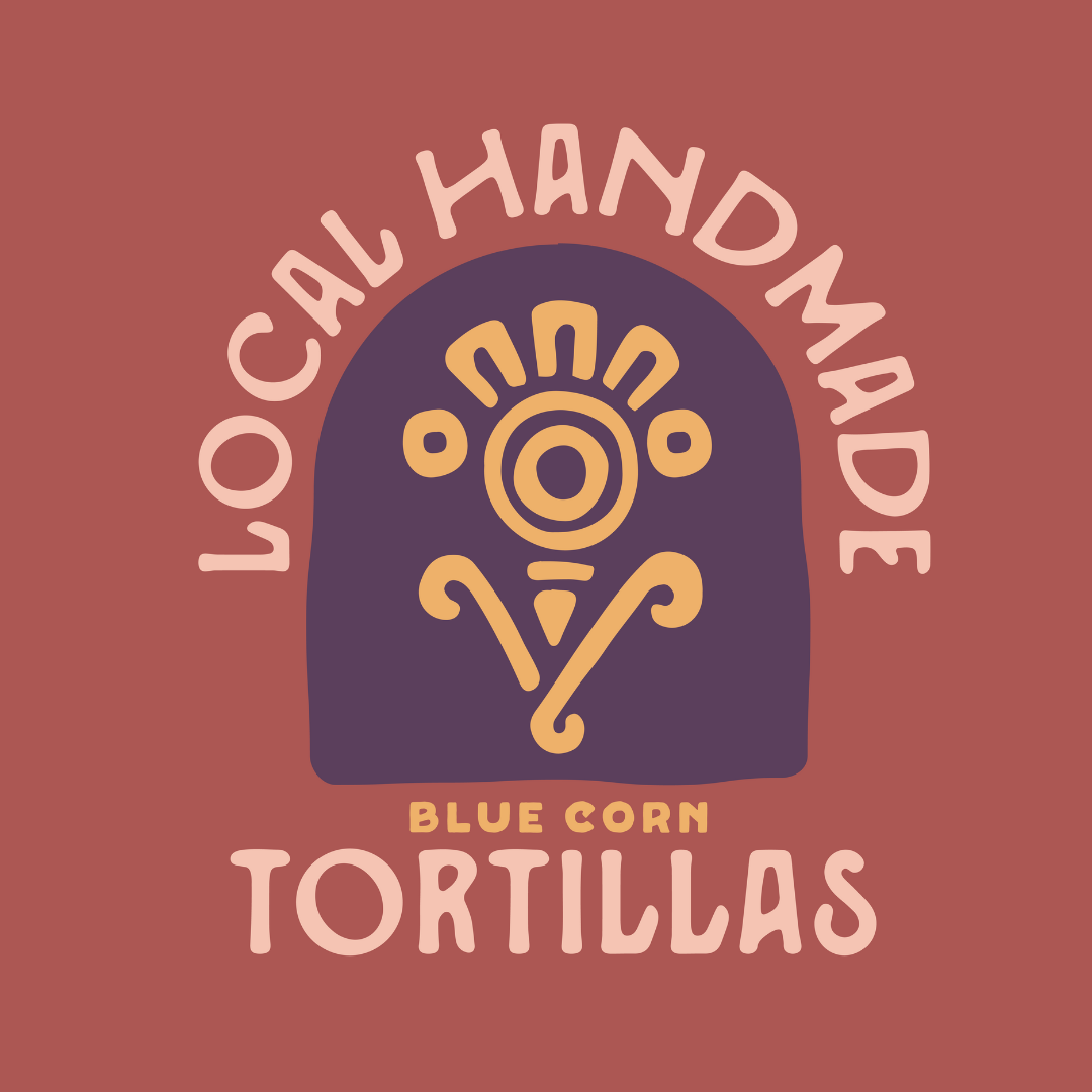 Graphic design featuring a purple arch with a yellow illustration of a stylized head with a circular face and line details. The background is reddish-brown. Text reads "Local Hand Made Blue Corn Tortillas" with "Local Hand Made" arcing around the top and "Blue Corn Tortillas" at the bottom.