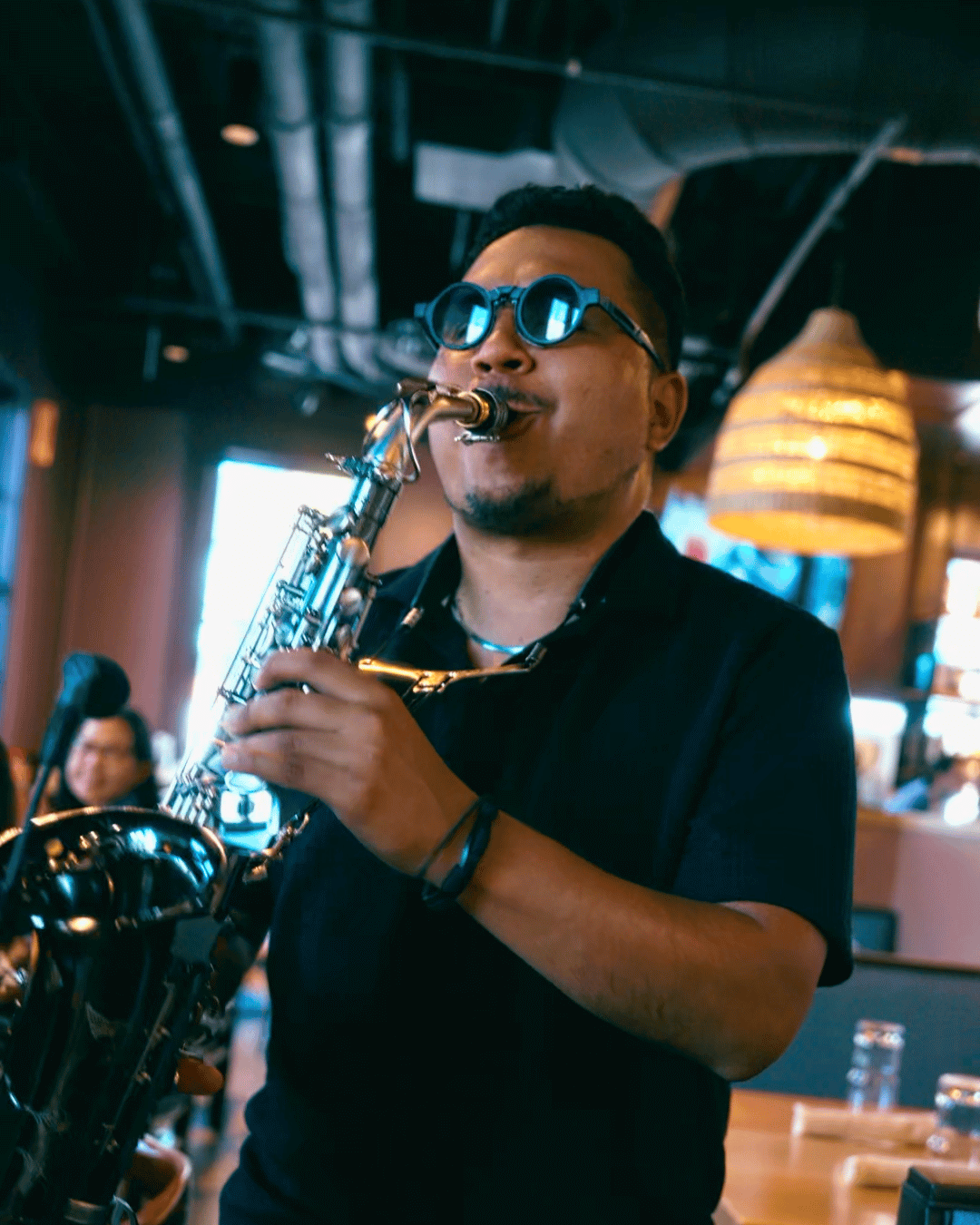 Saxophonist playing live jazz at Amasa Mexican Kitchen in Alpharetta