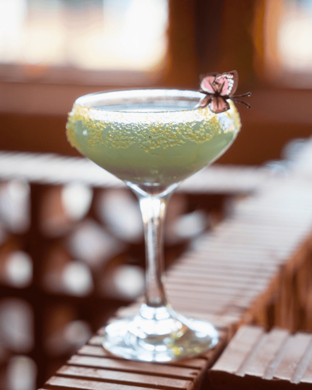 Day of the Dead Cantina cocktail garnished with a butterfly at Amasa Mexican Kitchen