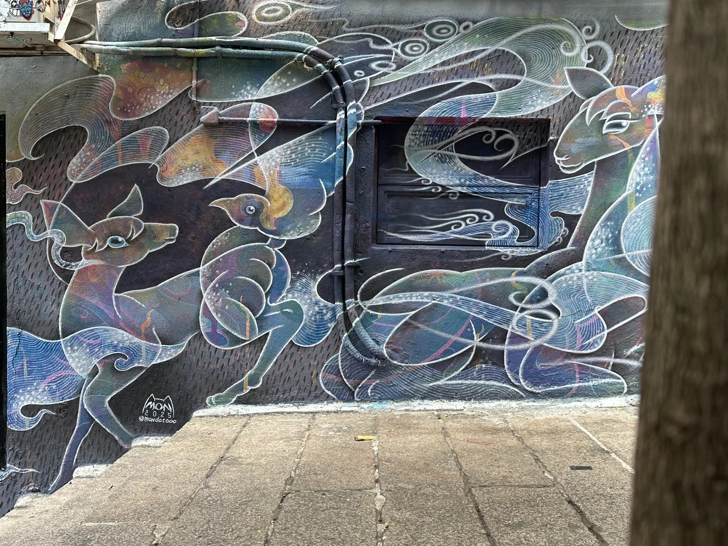 'Overlapping and Merging Life' by Japanese artist MON for HKwalls 2025 outside of La Cabane. 