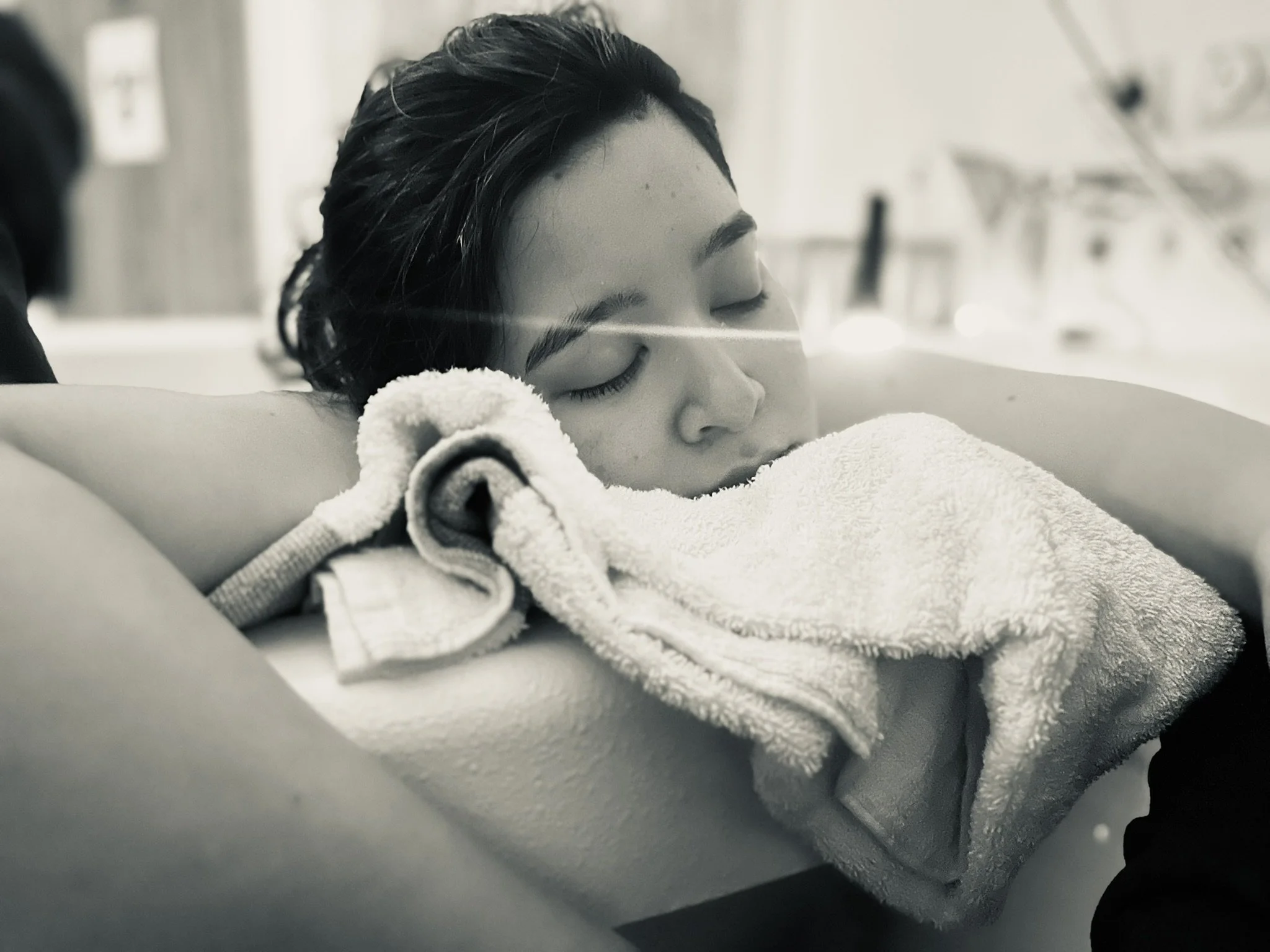 A woman in the latter stages of labour letting her body open and stretch