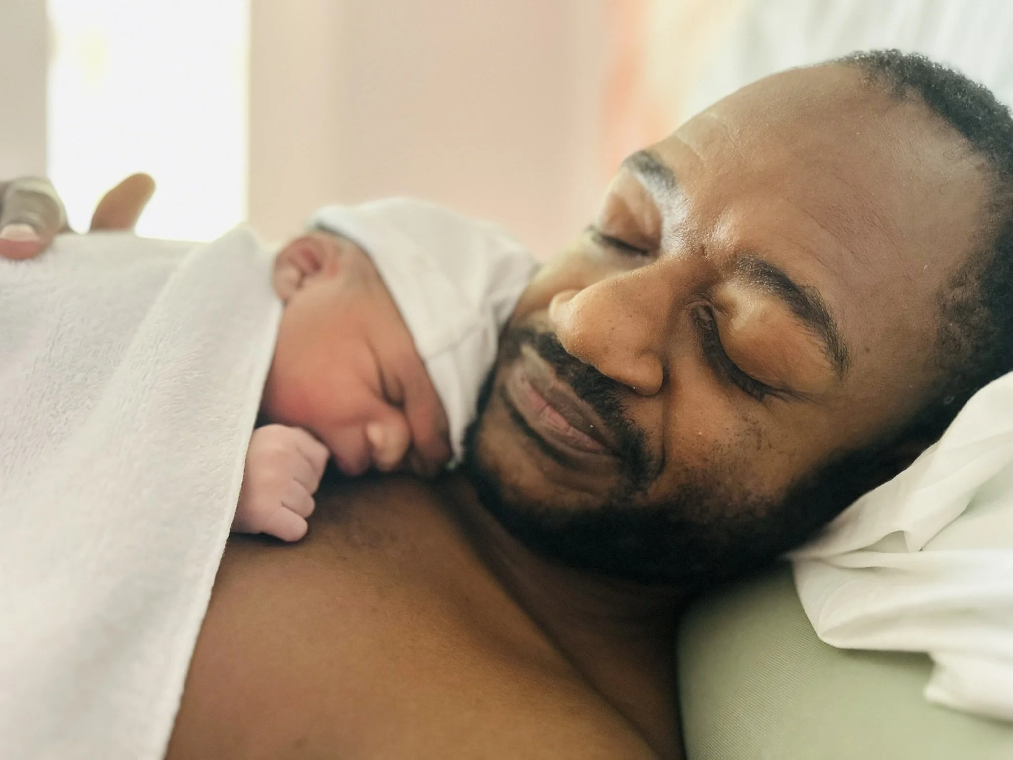 A doula can help fathers to feel involved in the birth with skin to skin contact