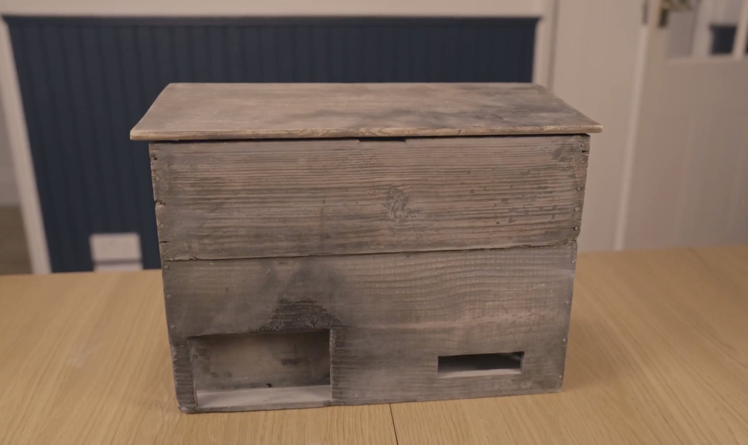 Hand build wooden box sitting on table.