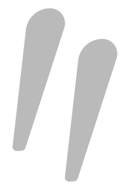Abstract grey open quote marks.