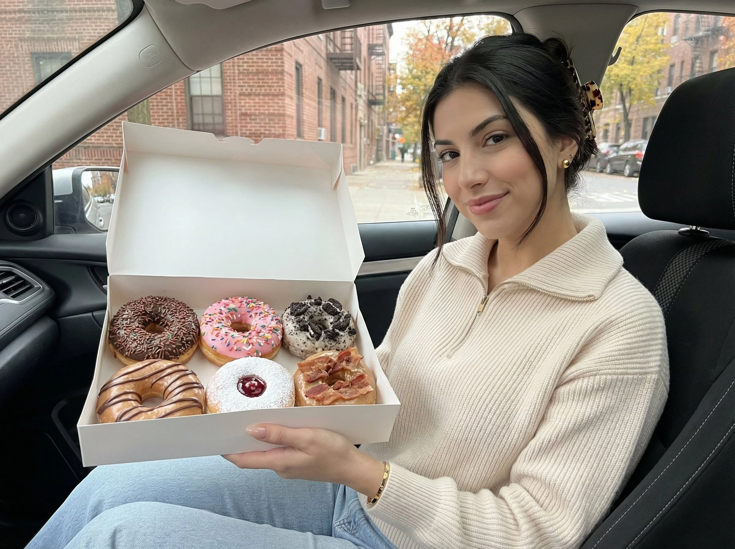 Brittany Yacko therapist holding donuts Time to Talk Therapy Chicago