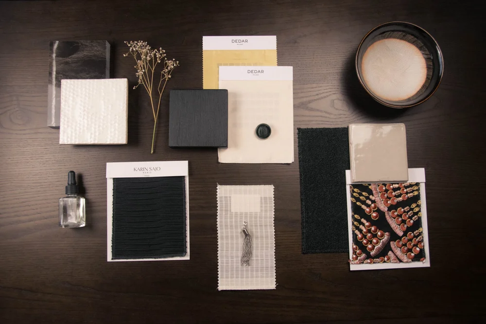 Material and finish sample flat lay for a Studio Cér consultation, including tile, fabric and ceramic pieces.