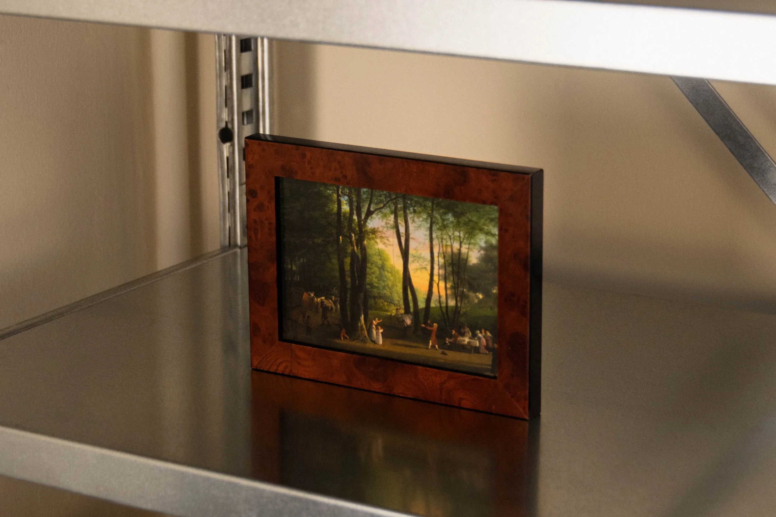 Art piece in wooden frame in Reflections Office