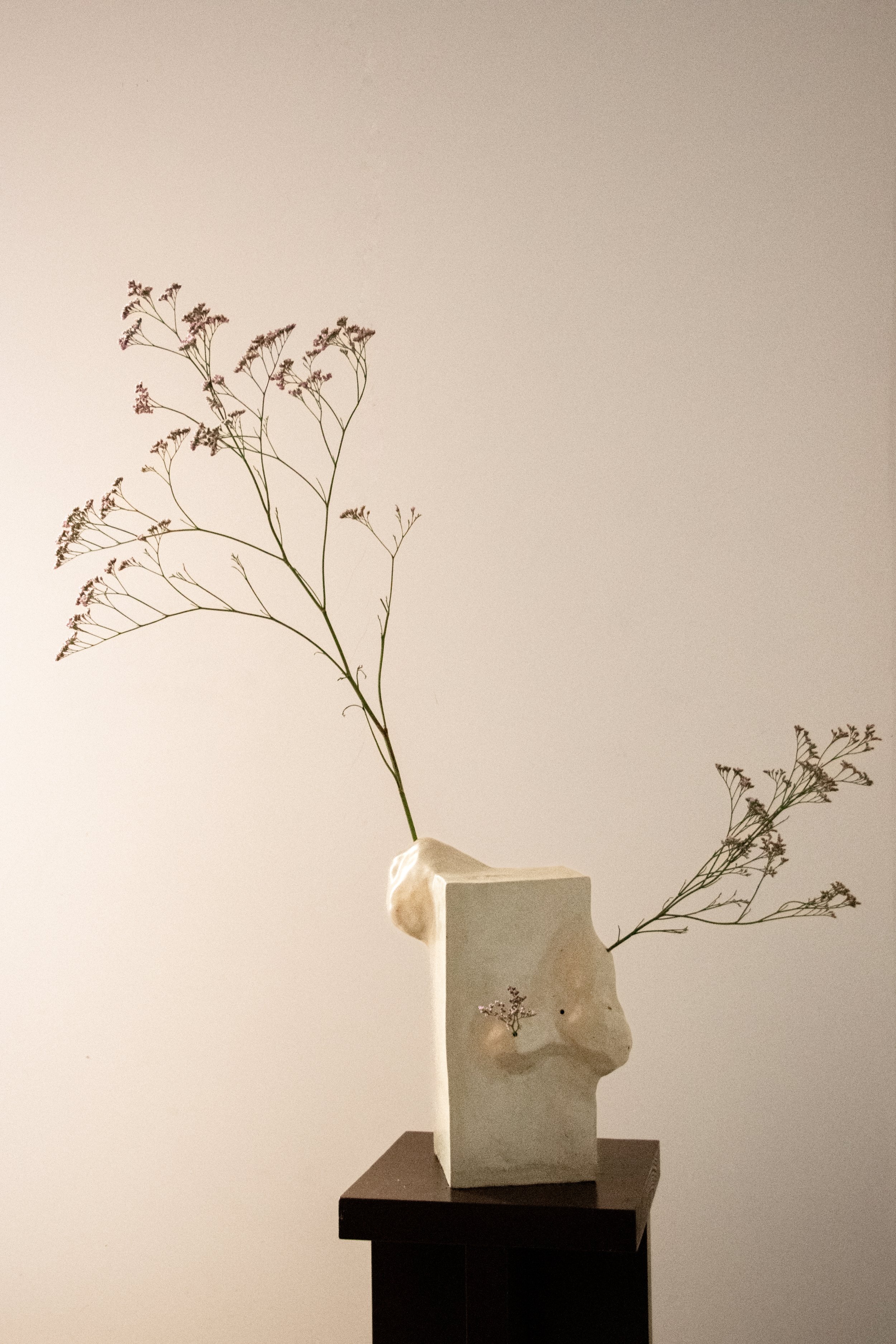 Sculptural ceramic vase with delicate florals and soft neutral tones