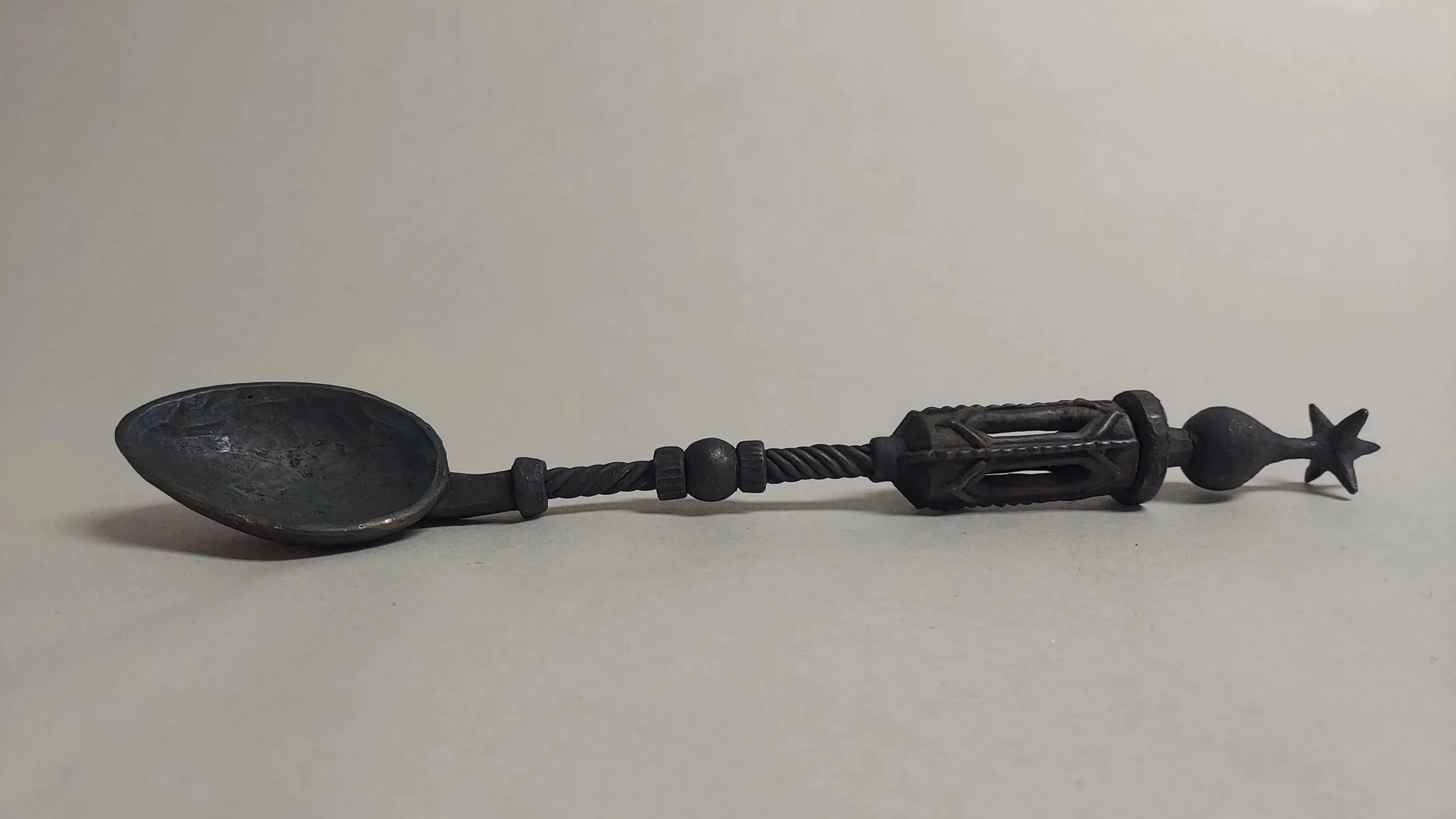 reliquary spoon, cast bronze