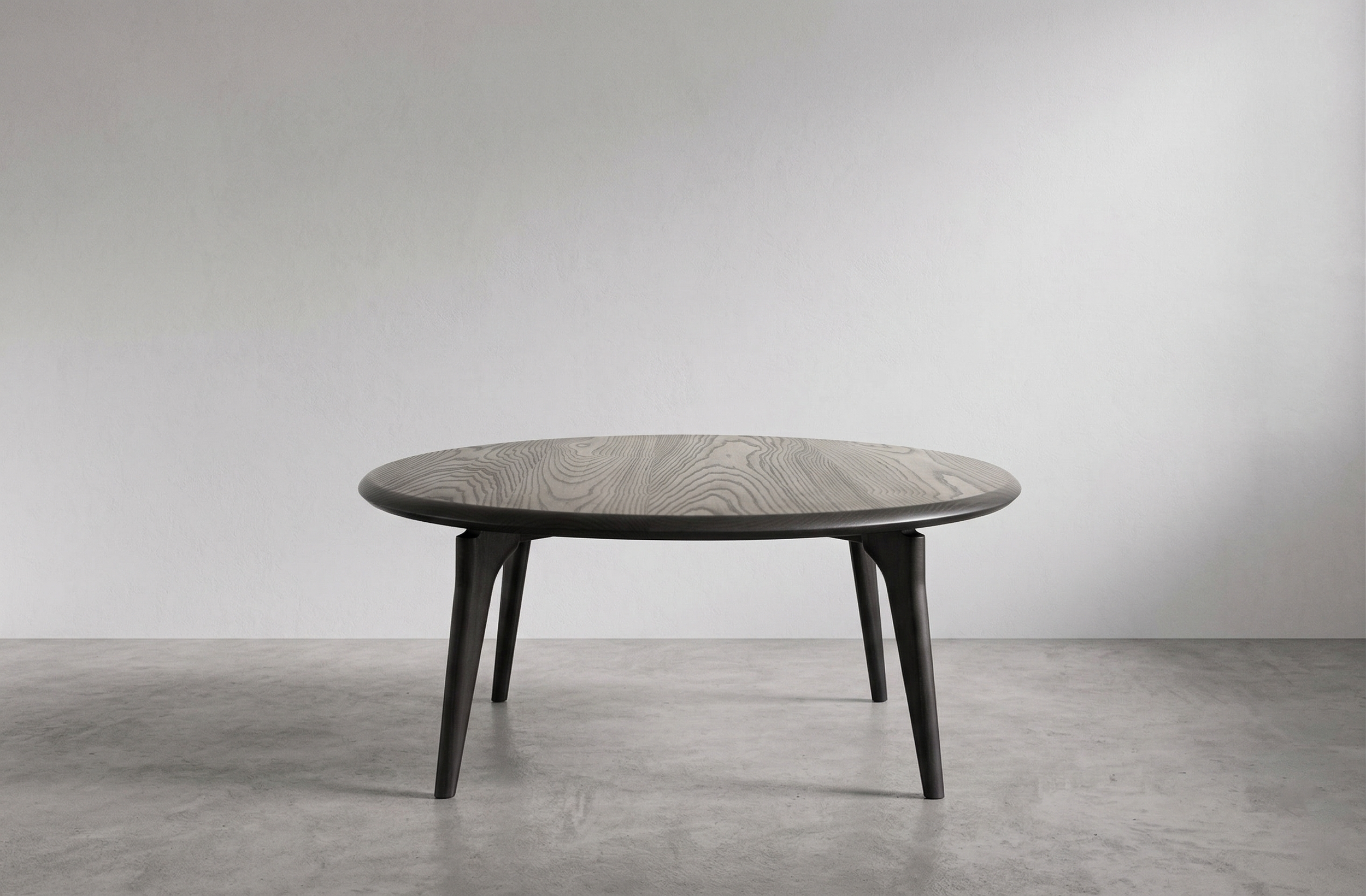 ebonized ash round coffee table.png
