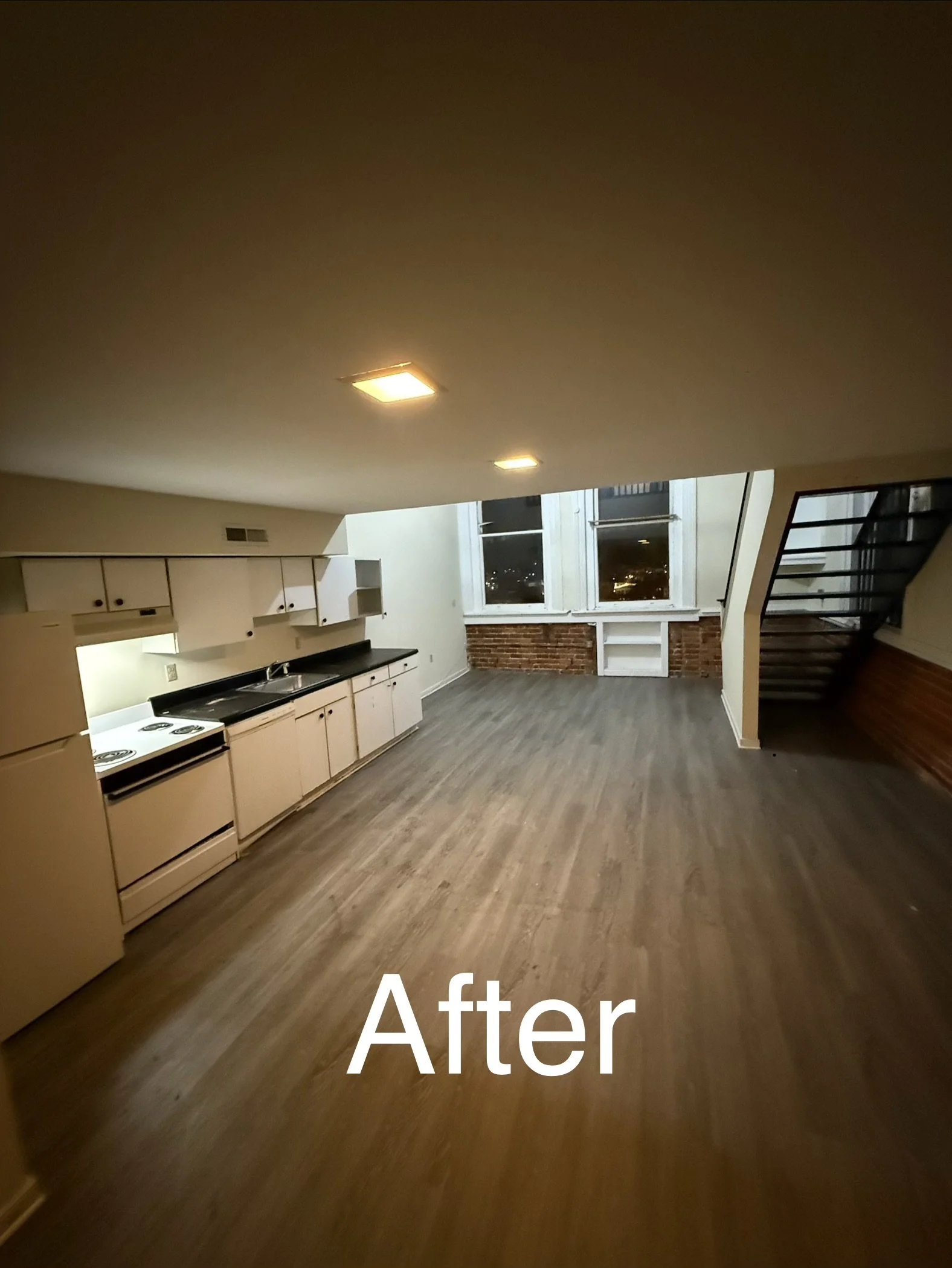 A renovated kitchen with white cabinets, a stove, large windows, and a staircase, with the word 'After' overlaid.