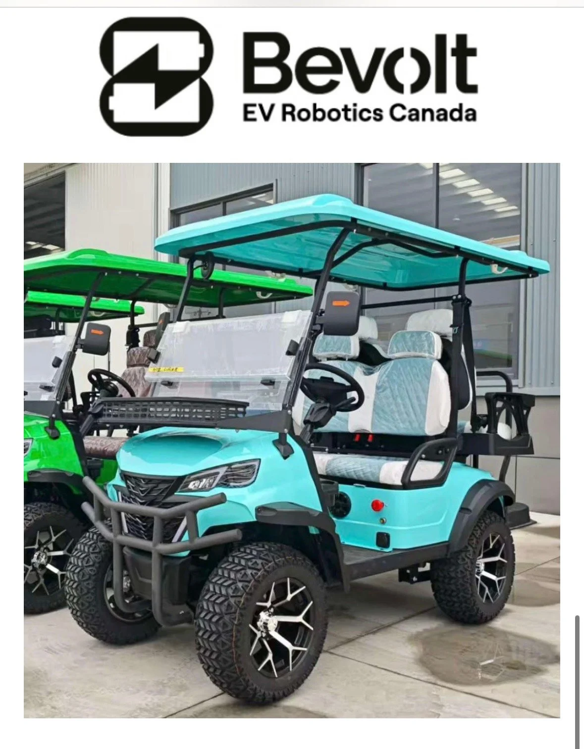 Electric golf cart with a light blue body, black roof, off-road tires, and white interior seats, parked outside a building with large windows.