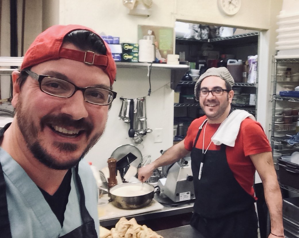 Chris and Alessandro in the kitchen prepping for a catering event