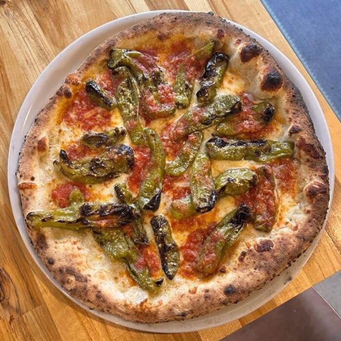 Special Shishito pizza with shishito peppers and spicy tomato sauce