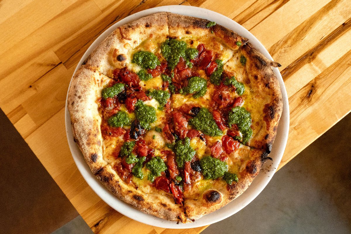 Quattro Formaggi al Pesto pizza special with cherry tomatoes and pesto