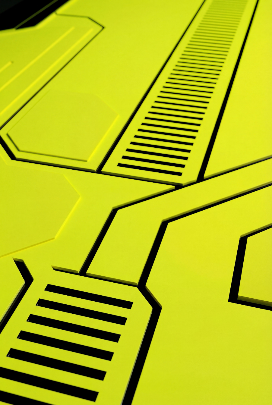 Close-up image of a yellow panel with black lines and vents, likely part of a futuristic vehicle or machine.
