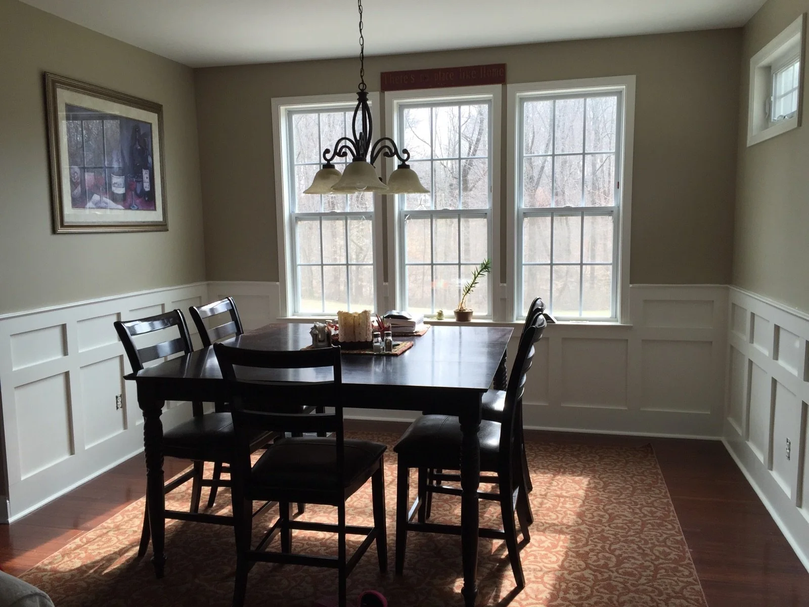 Dining room with painted custom wainscot trim paneling carpentry