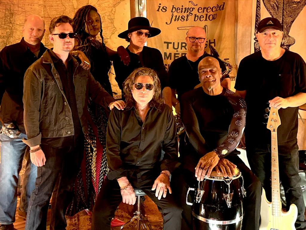 The nine-member band, Ndichu, playing a fusion of funk, rock, and R&B.