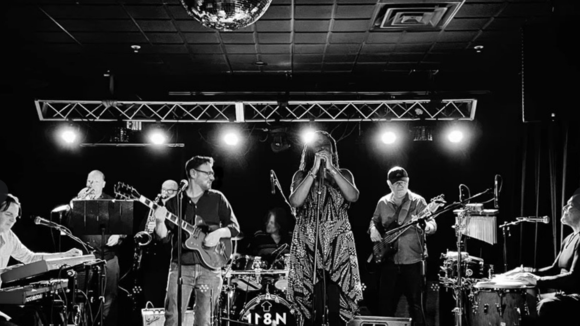 Liz Ndichu and band, playing a fusion of funk, rock, and R&B.