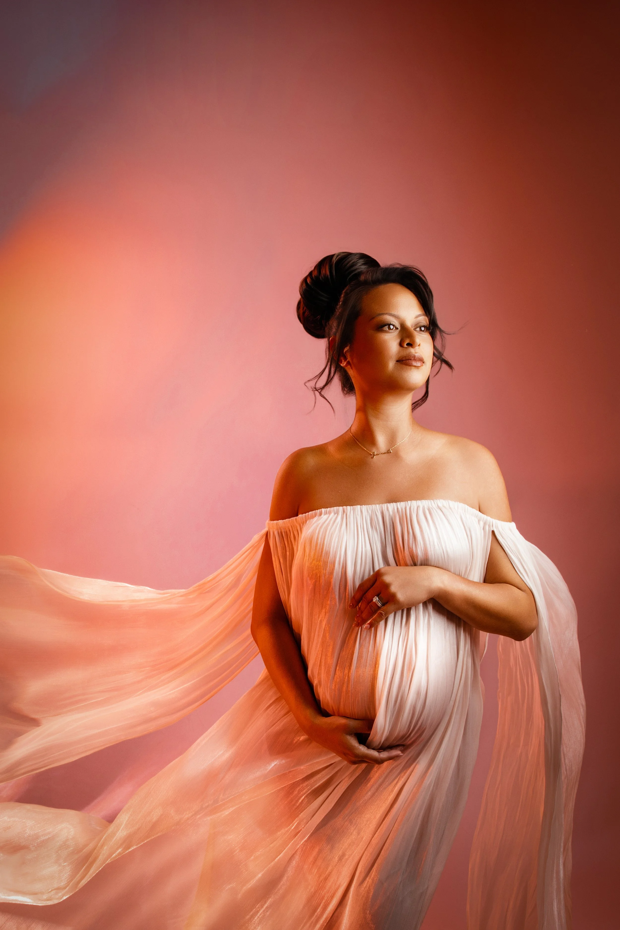 Fine art studio maternity photography with elegant flowing fabric, soft romantic lighting, and timeless styling by Bay Area maternity photographer Esther Kay.