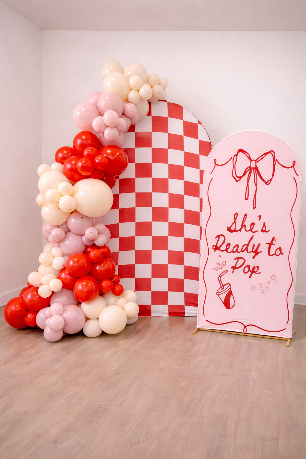 Retro "She's ready to pop" themed baby shower backdrop and balloon design