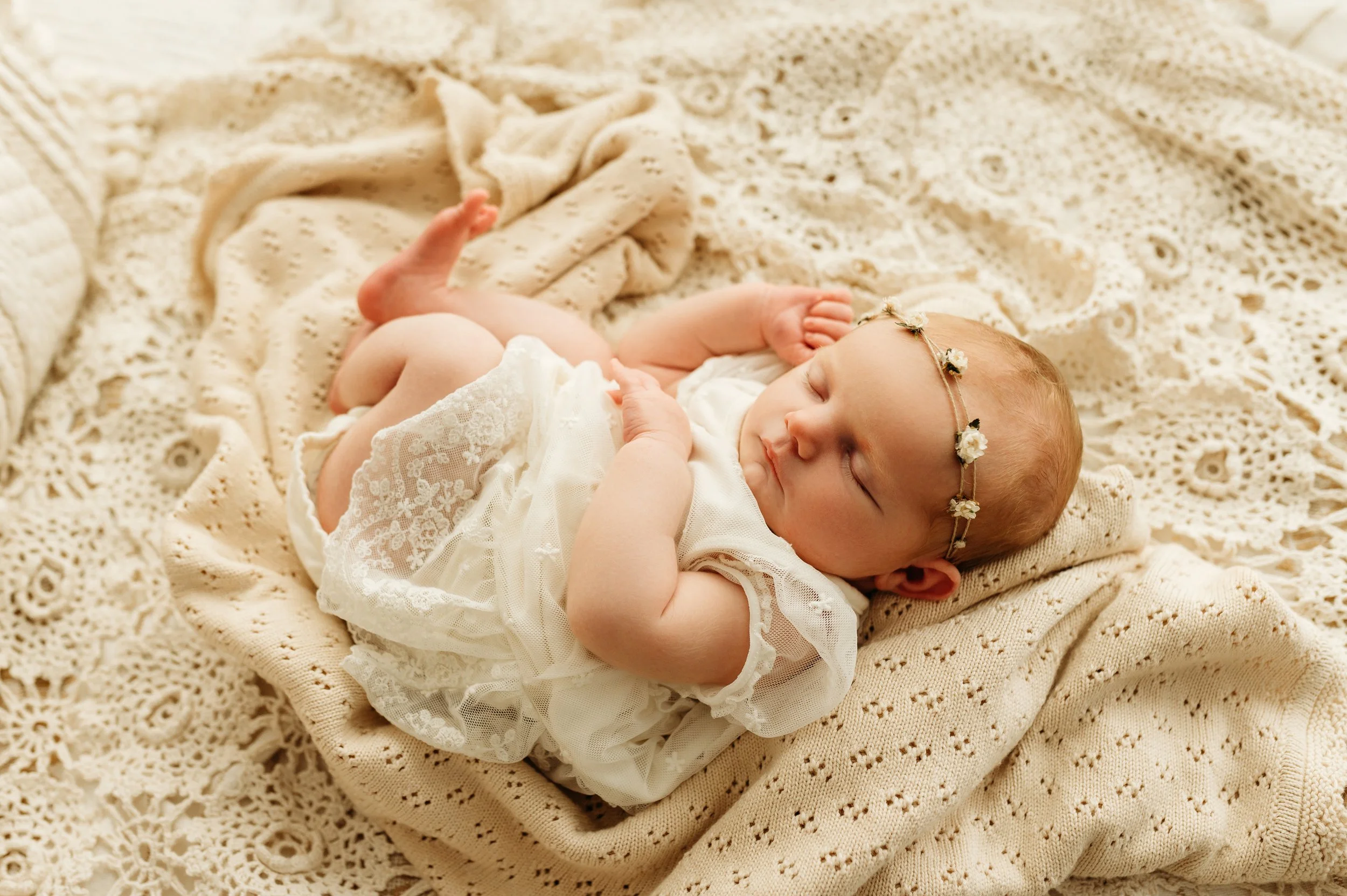precious newborn baby girl on a lace blanket in Pleasant View, TN studio