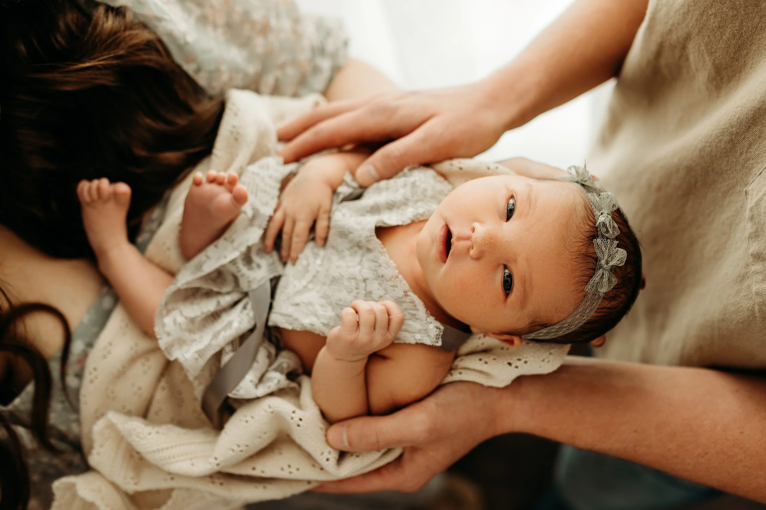 Beautiful newborn baby girl giving eye contact near Clarksville, TN