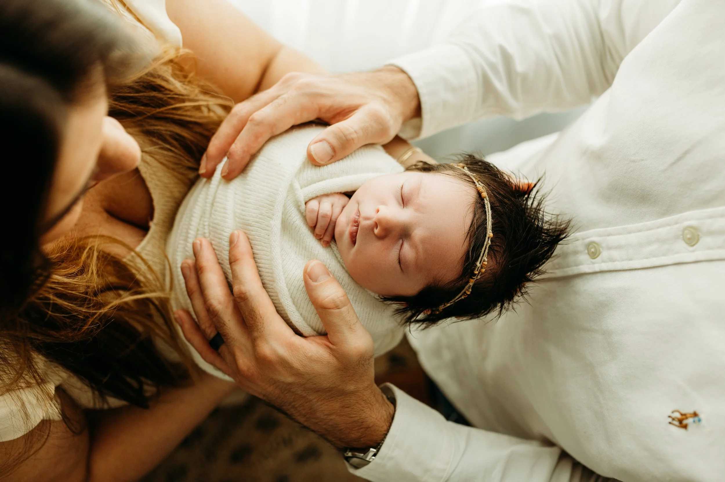 nashville tn newborn baby girl swaddled in a soft white wrap for her newborn session