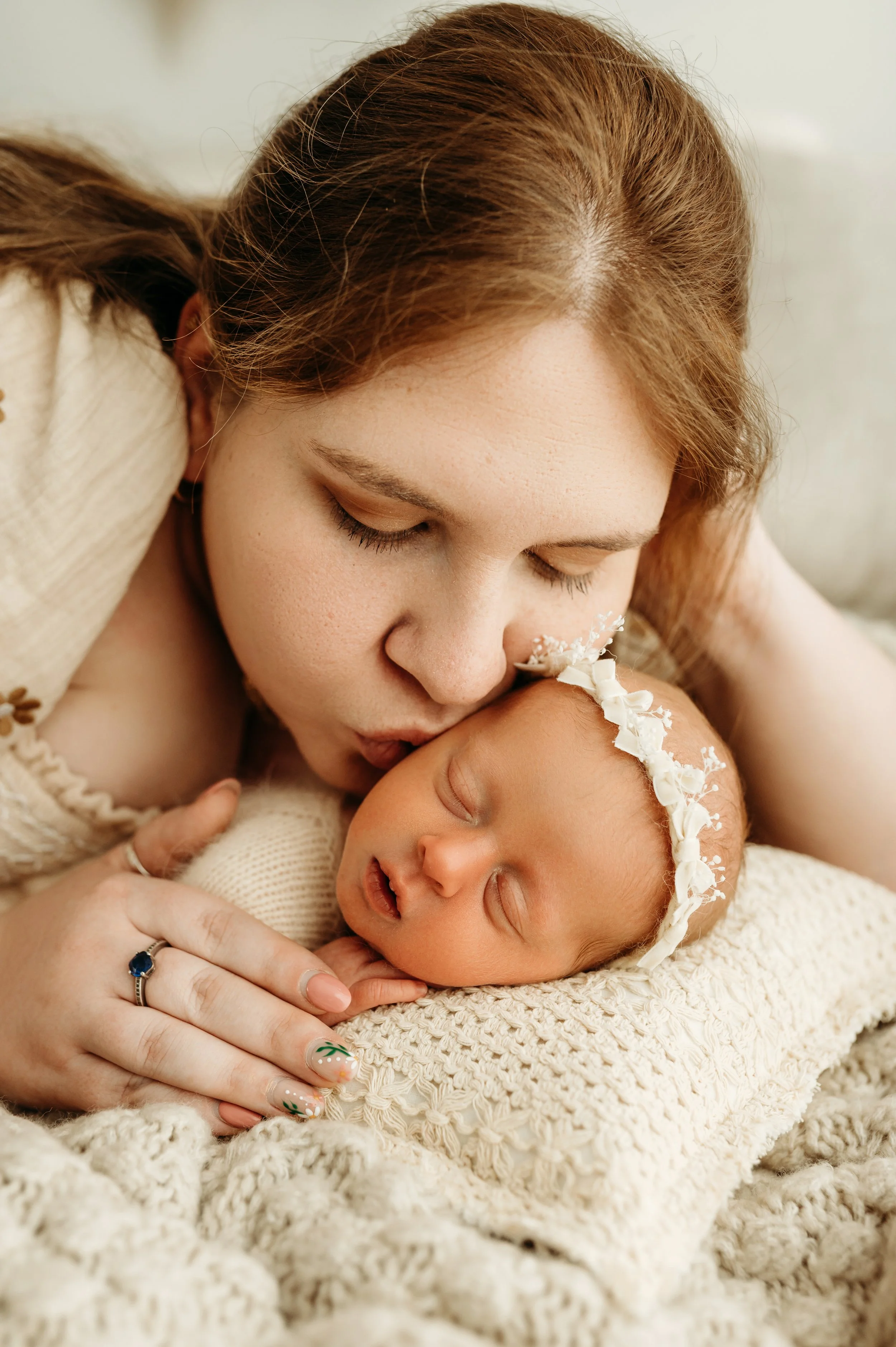 Ashland City, TN newborn session of mom kissing her new baby near Nashville