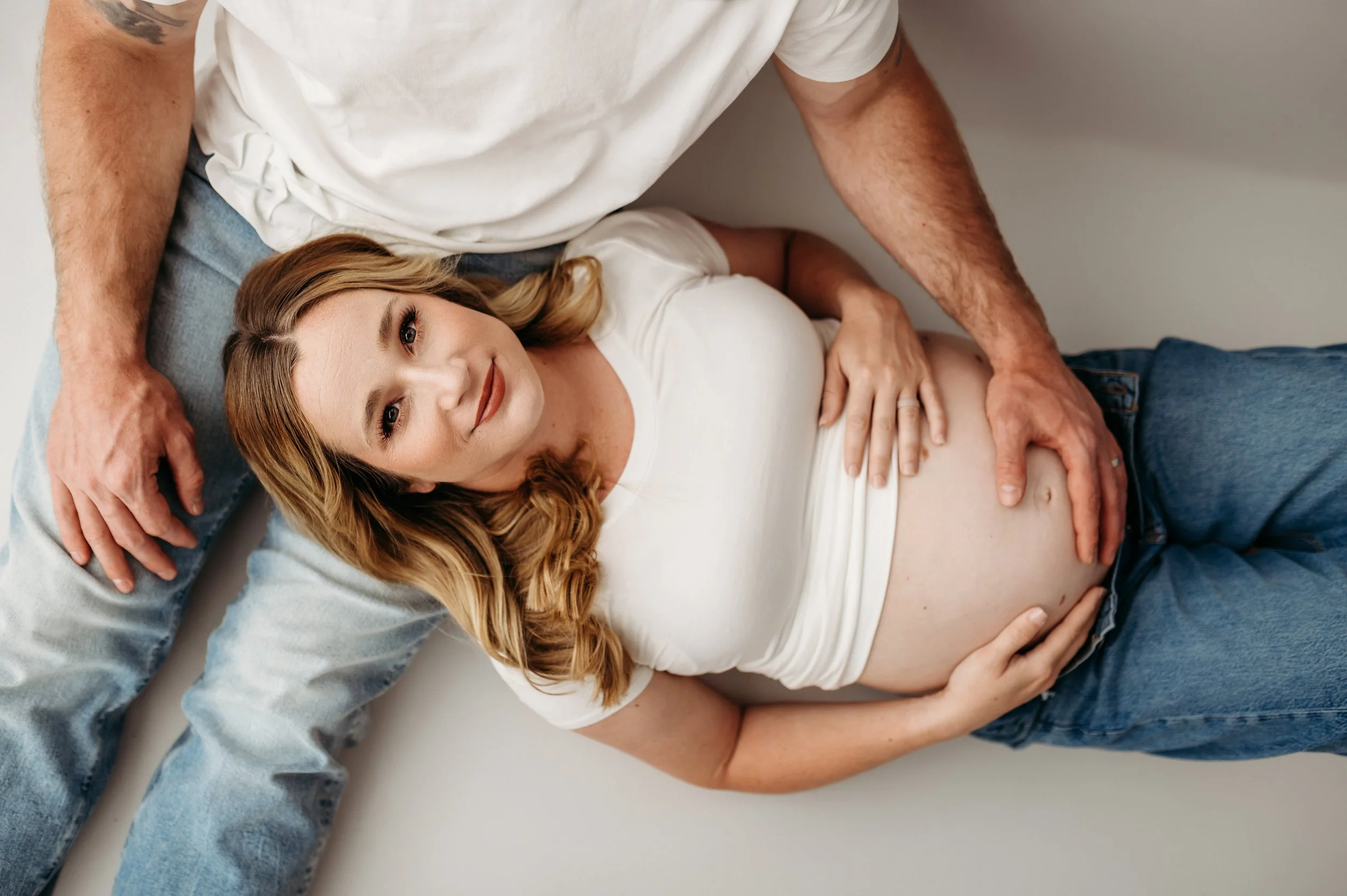 Clarksville, TN mom to be in Bethany Jones photography's white studio for her maternity session