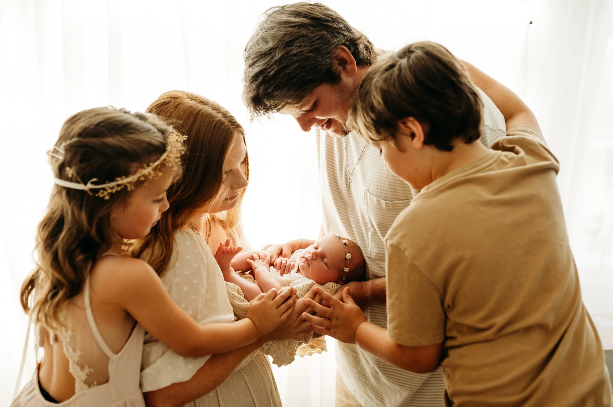 Nashville, TN family holding their newborn baby girl