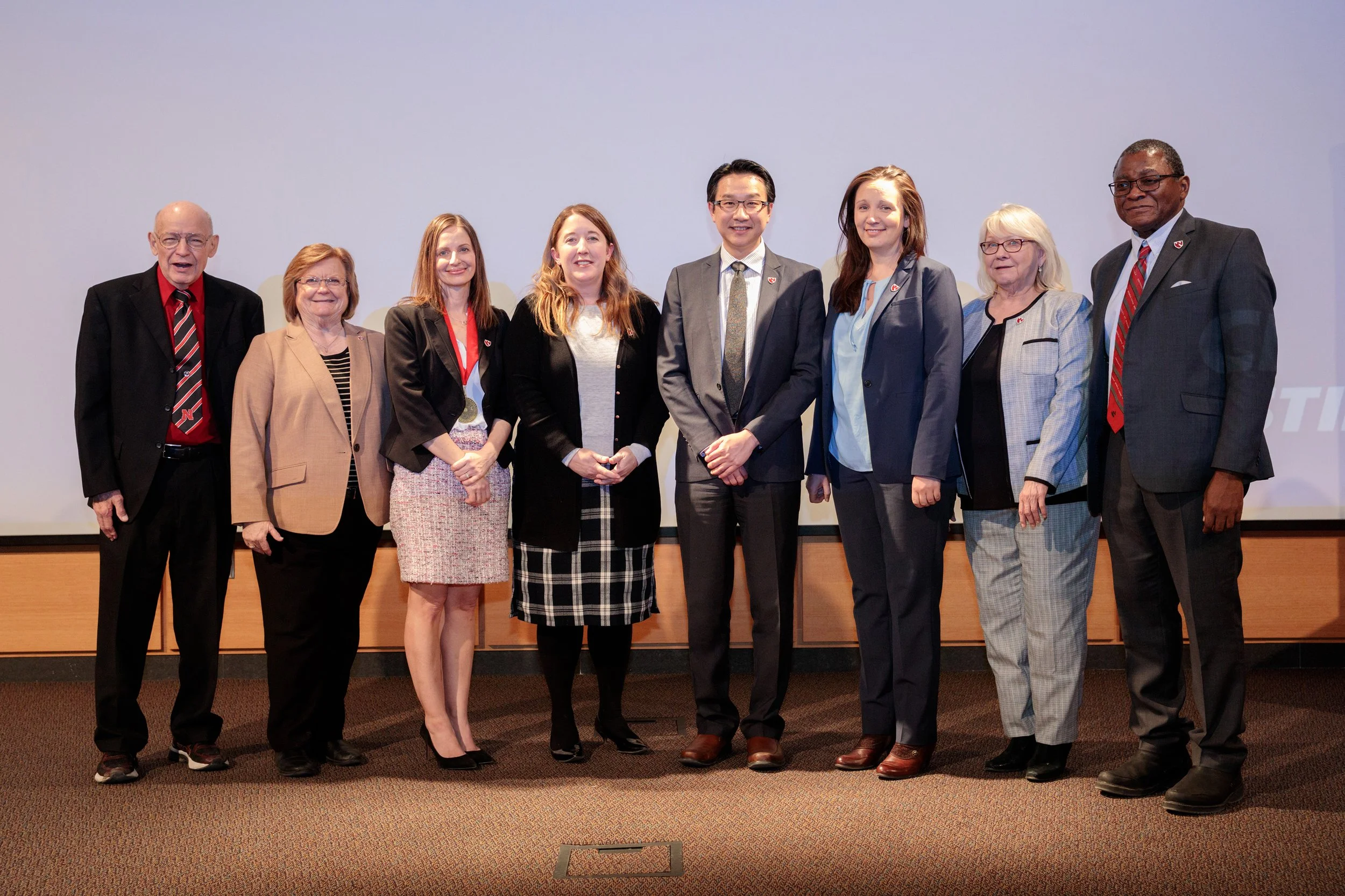 Dr. Davies poses with faculty during awards ceremony