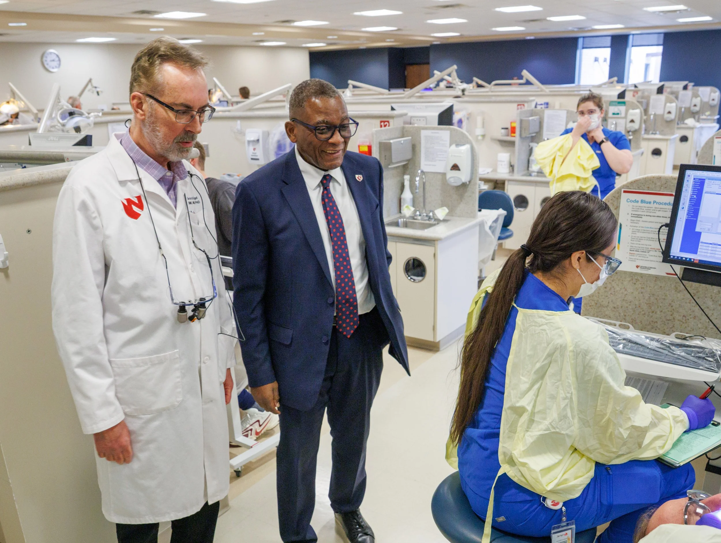 Dr. Dele Davies tours dental clinic and talks to faculty and students
