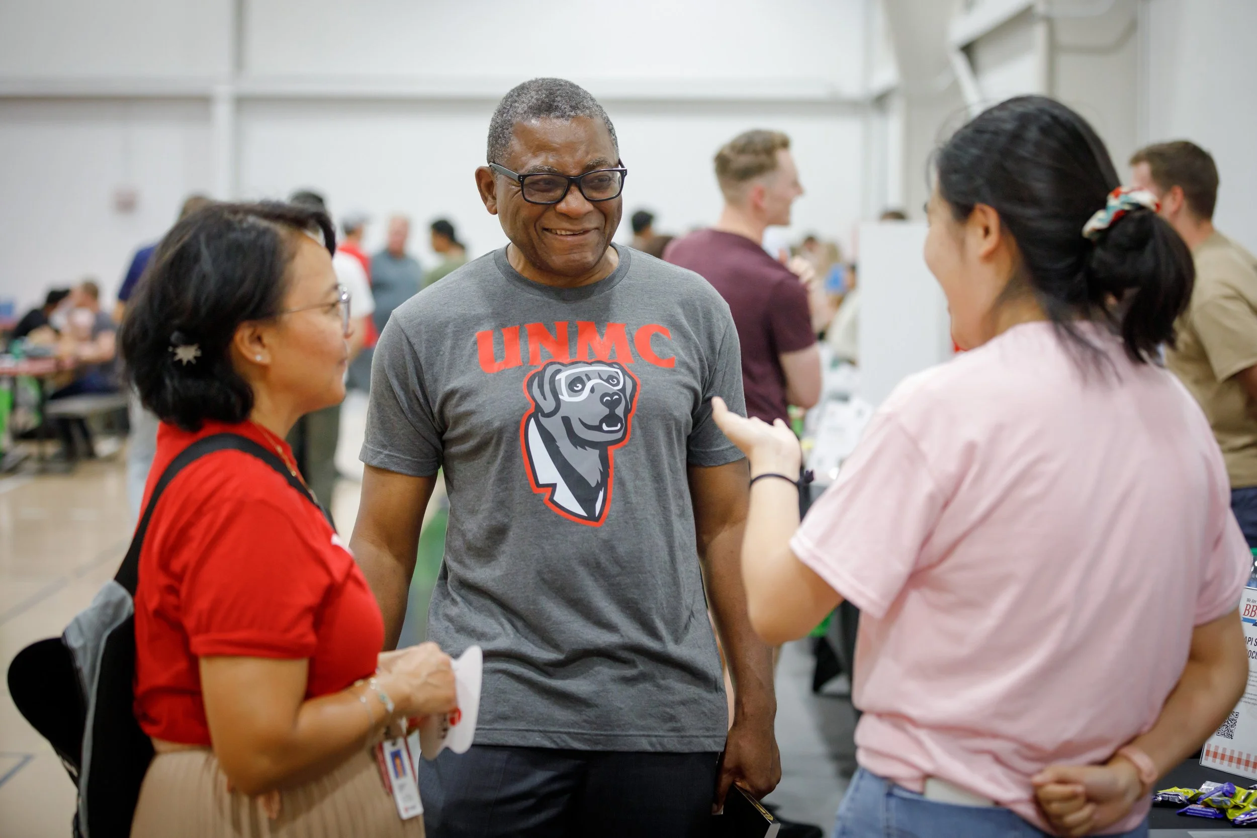 Dr. Davies talks to student and faculty at welcome event