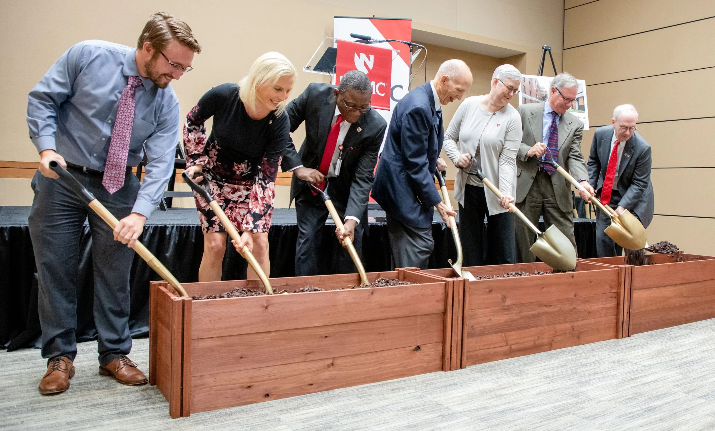 Dr. Dele Davies, donor and university leaders shovel dirt at groundbreaking ceremony